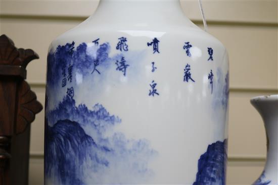 A Chinese blue and white baluster vase, decorated with a landscape, Largest 17.25in.